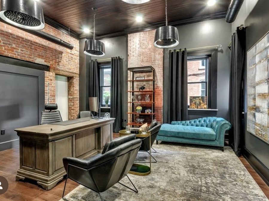 Luxury home office remodel with exposed brick and industrial pendants by Engle Construction Group