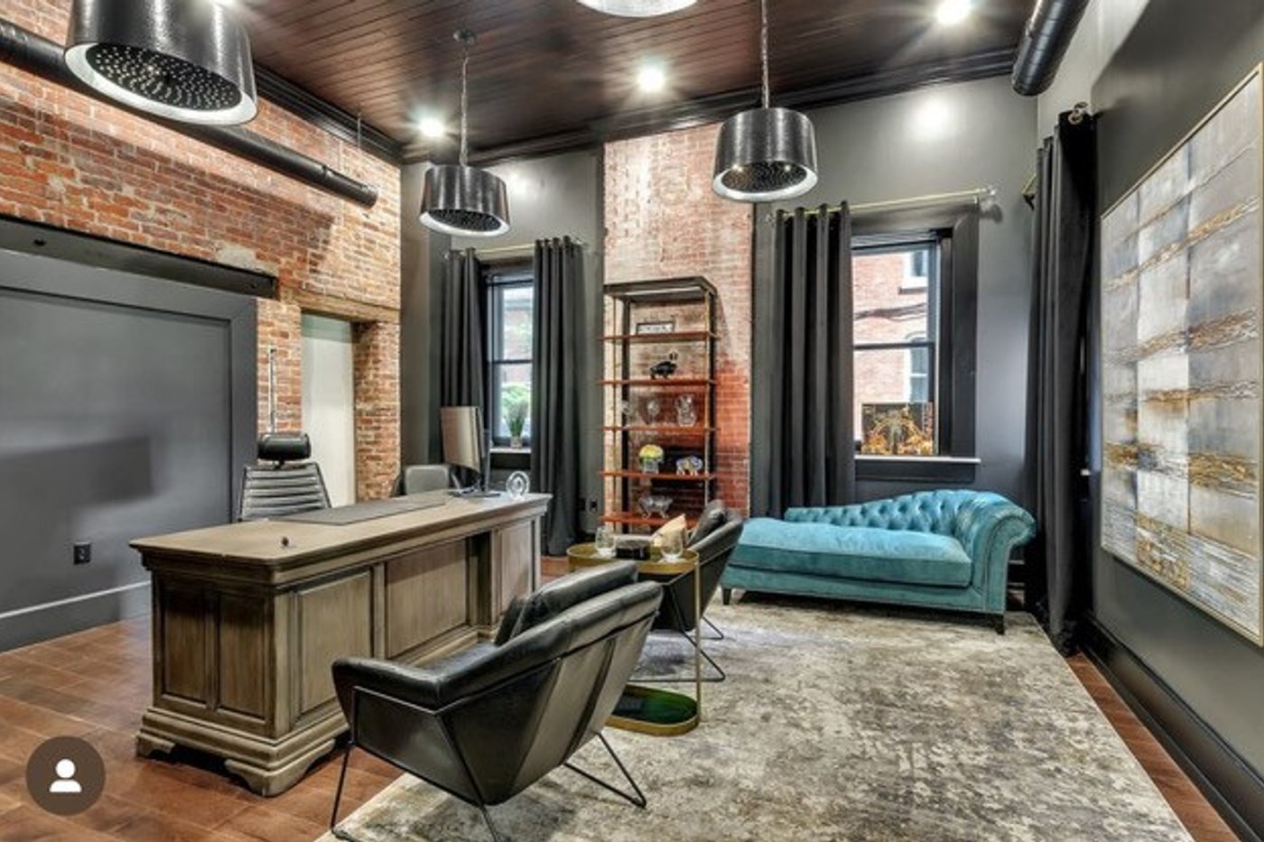Luxury home office remodel with exposed brick and industrial pendants by Engle Construction Group