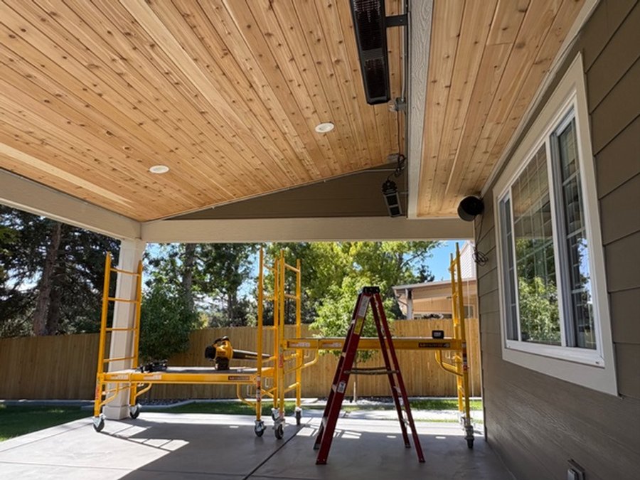 Cedar tongue-and-groove ceiling on a covered patio with recessed lighting