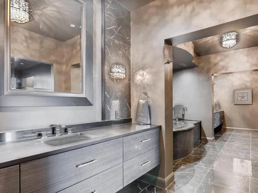Ritz-Carlton penthouse primary bath with double vanity and soaking tub