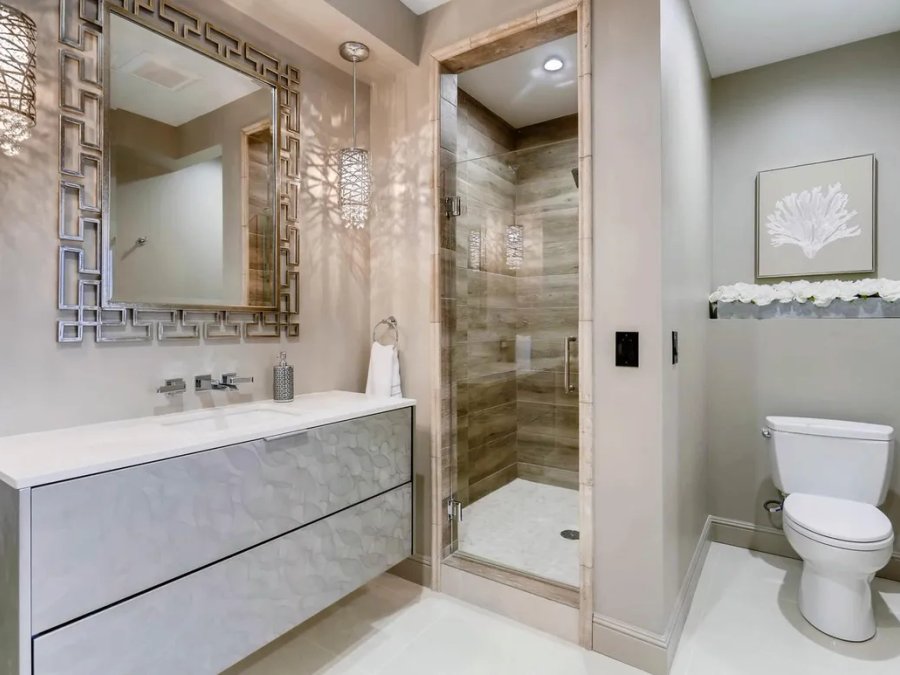 Ritz-Carlton penthouse secondary bath with floating vanity and tile shower