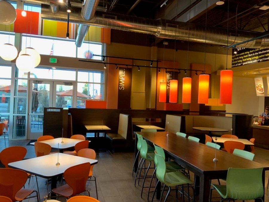 Commercial restaurant build with pendant lights and booth seating, finished
