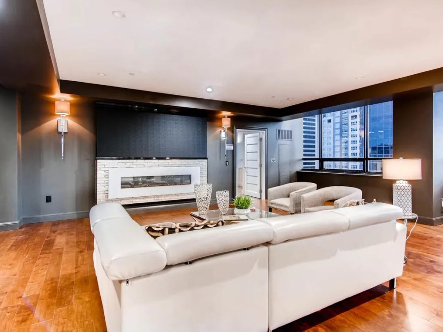 Ritz-Carlton penthouse living room with city views and linear fireplace