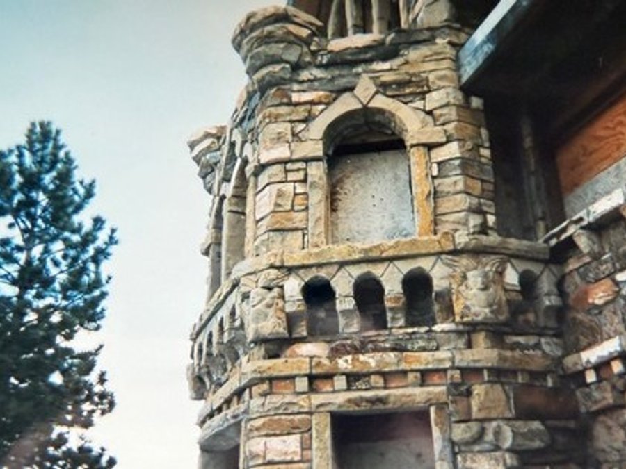 Stone turret detail with ornate masonry and arched niches