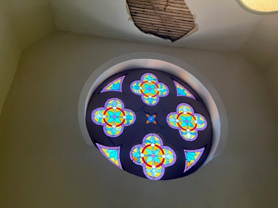 Close-up of rose window stained glass during restoration