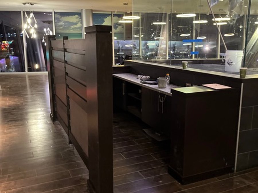 Custom dark wood millwork divider wall