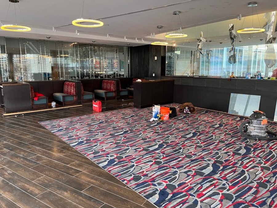 Hotel restaurant remodel near completion with installed carpet and ring lights