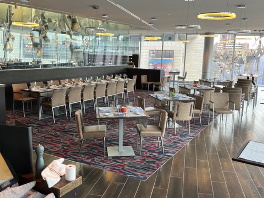 Finished hotel restaurant dining room with ring pendant lights