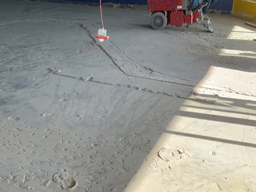 Commercial floor demo grinding in a retail space
