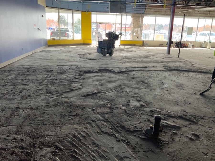 Retail floor scraping machine during commercial demo